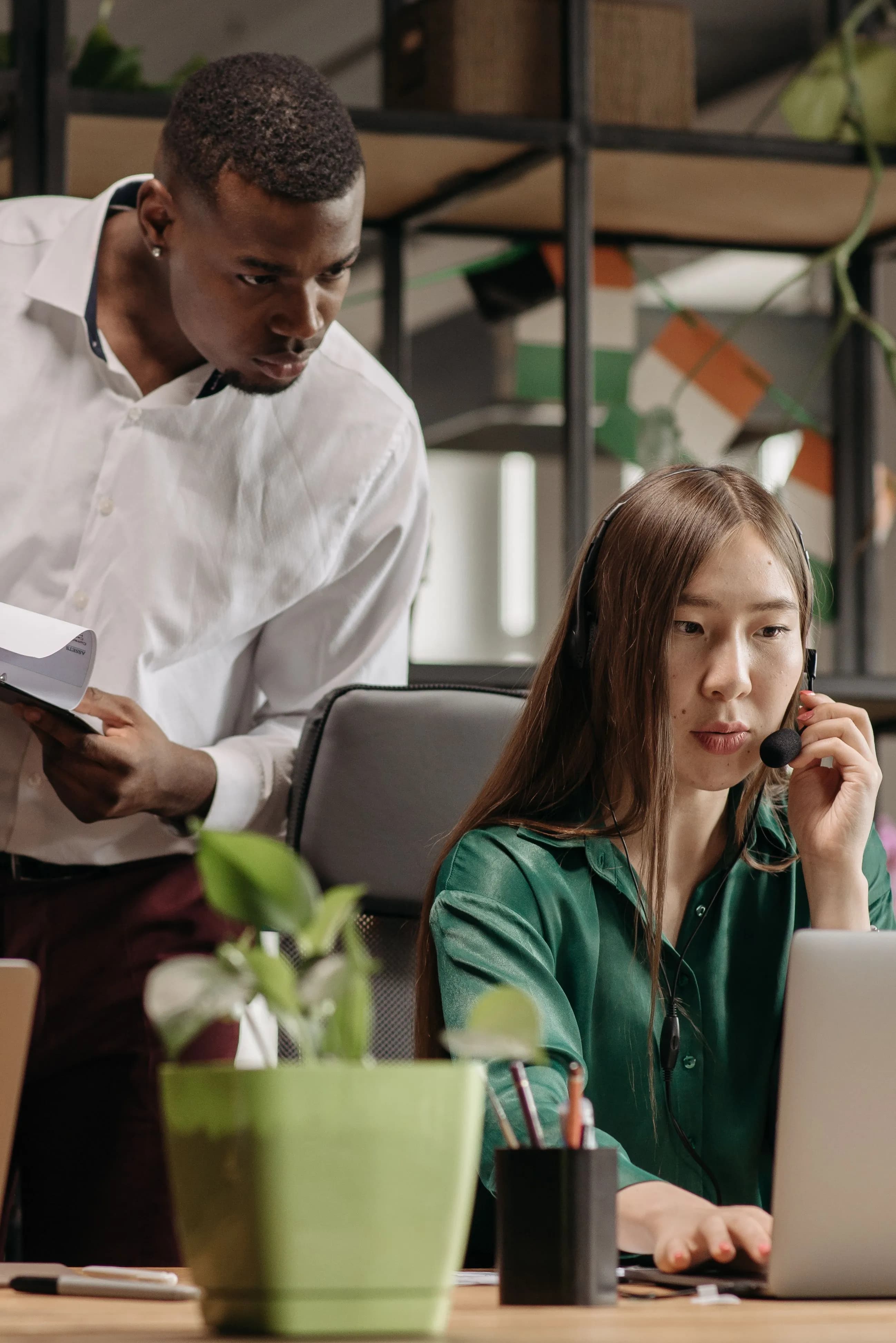 A ProAdvisor working through a client's books alongside their finance officer